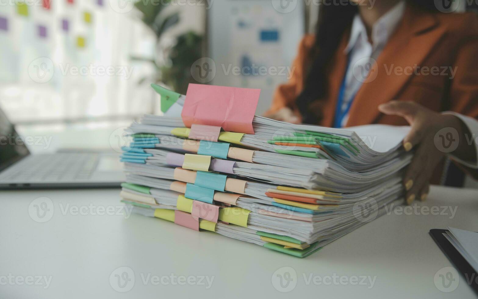 Group of confident business people point to graphs and charts to analyze market data, balance sheet, account, net profit to plan new sales strategies to increase production capacity. photo