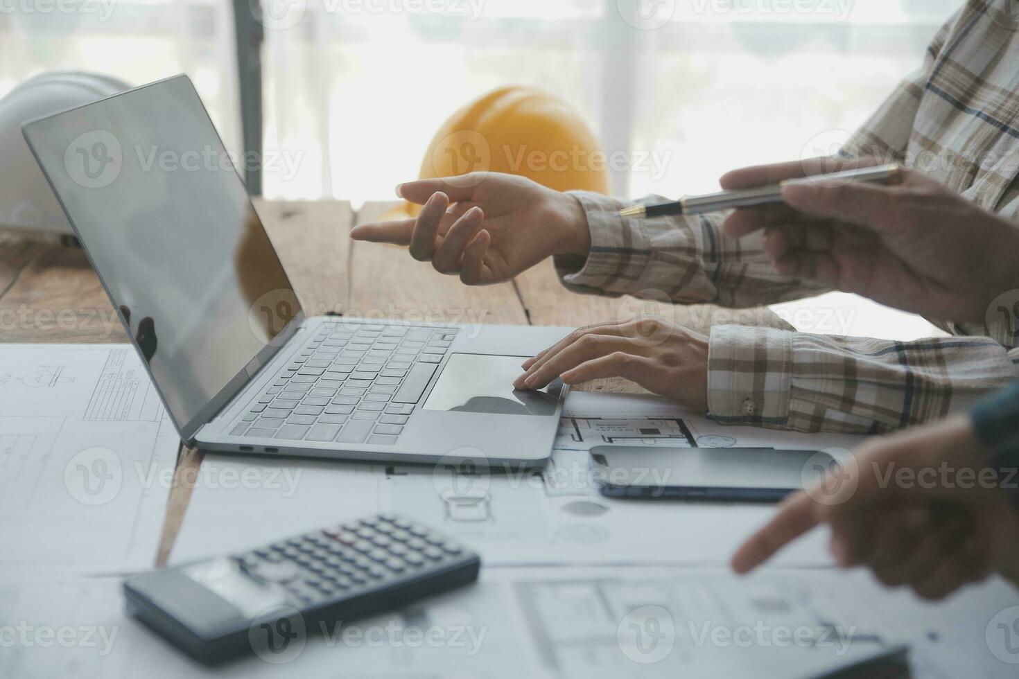 Two business man construction site engineer. Engineering objects on workplace with partners interacting on background photo