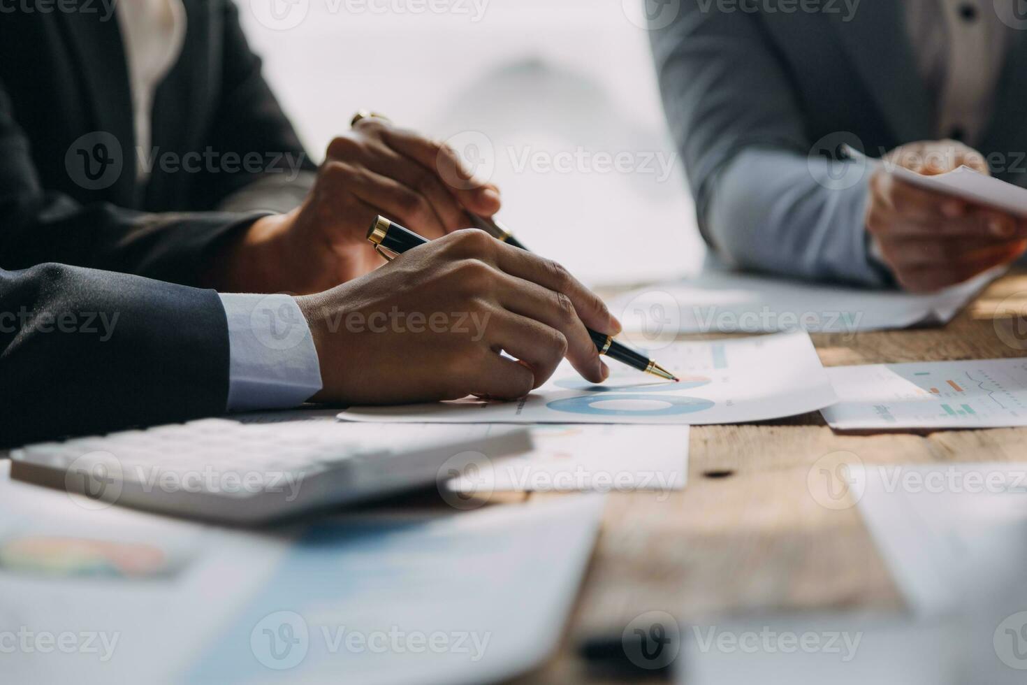 Brainstorming Collaboration and successful partnership analysis by Young business Asian people working in an office workspace photo