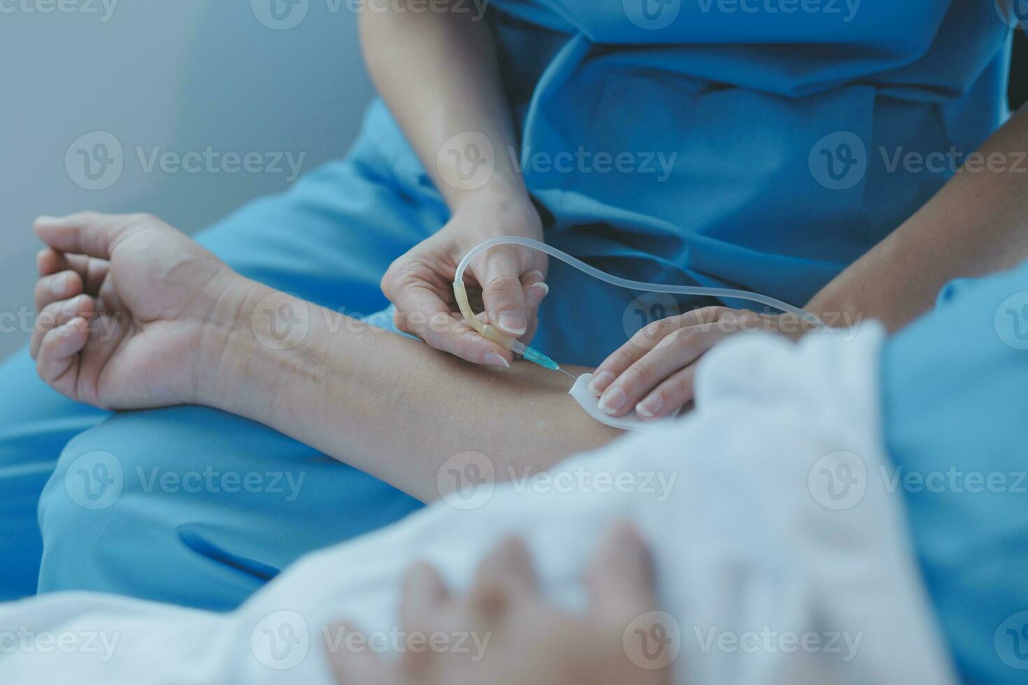 Injured patient showing doctor broken wrist and arm with bandage in hospital office or emergency room. Sprain, stress fracture or repetitive strain injury in hand. Nurse helping customer. First aid. photo