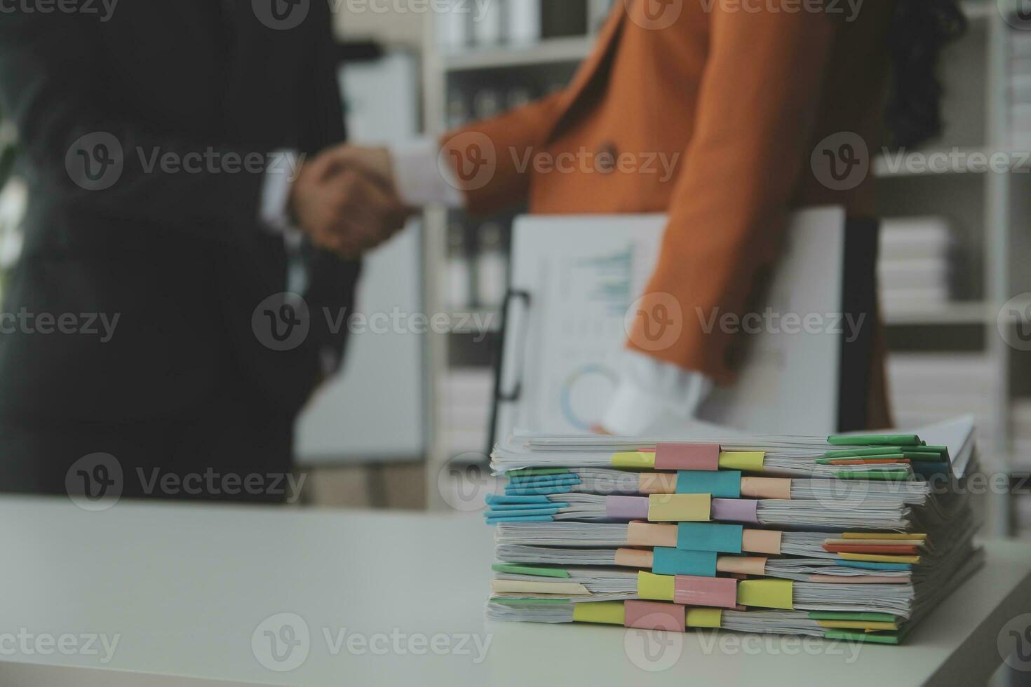 Group of confident business people point to graphs and charts to analyze market data, balance sheet, account, net profit to plan new sales strategies to increase production capacity. photo