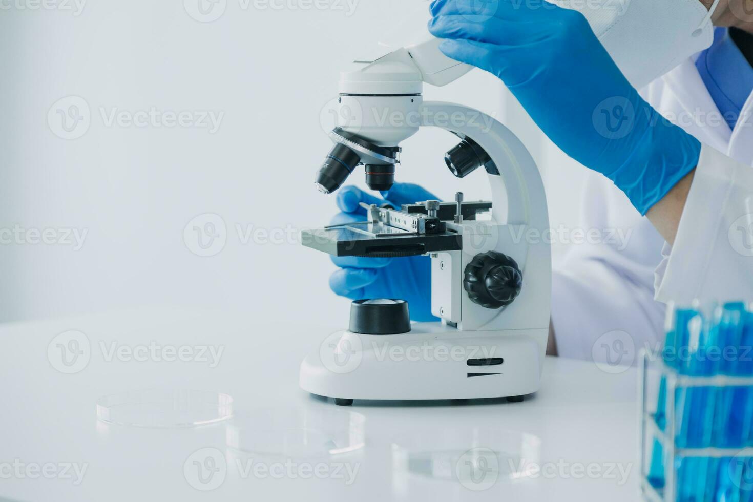 microscope with lab glassware, science laboratory research and development concept photo