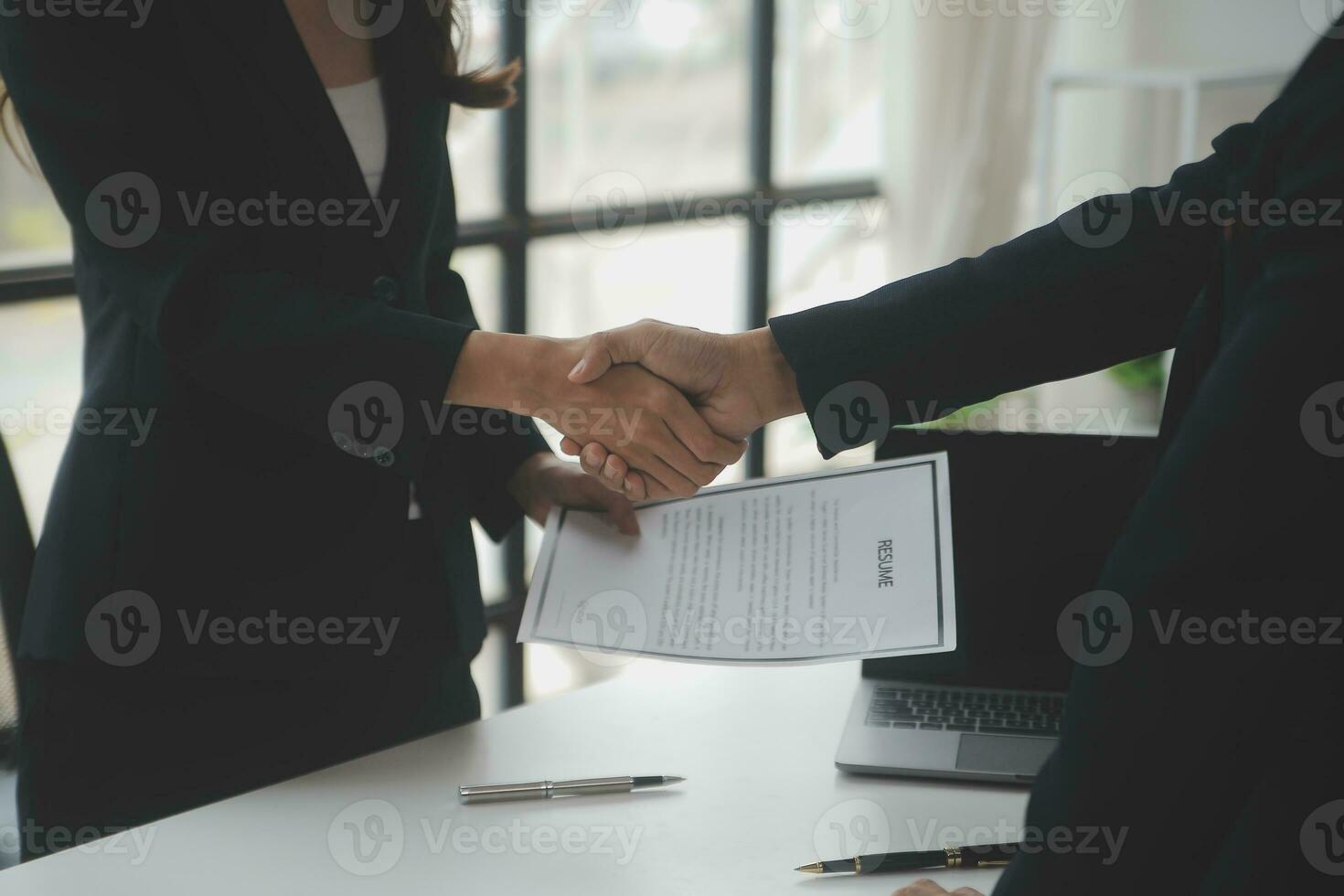 Close up view of job interview in office, focus on resume writing tips, employer reviewing good cv of prepared skilled applicant, recruiter considering application, hr manager making hiring decision photo