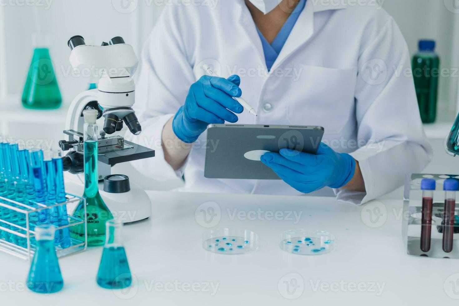 microscope with lab glassware, science laboratory research and development concept photo