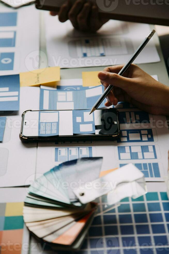 ux Graphic designer creative sketch planning application process development prototype wireframe for web mobile phone . User experience concept. photo