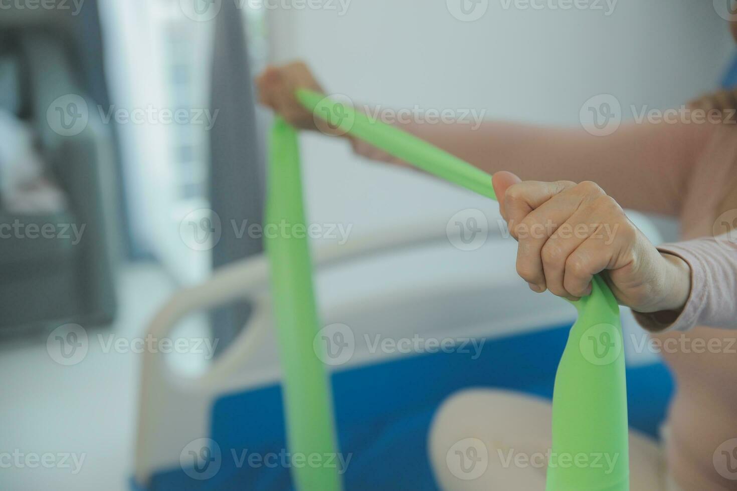 Doctor or physical therapist examines back pain and spinal area to give advice within the rehabilitation center. photo