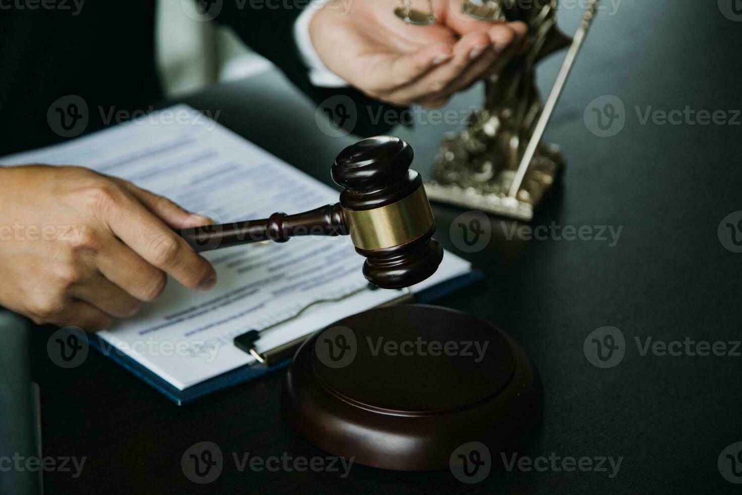 Business and lawyers discussing contract papers with brass scale on desk in office. Law, legal services, advice, justice and law concept picture with film grain effect photo