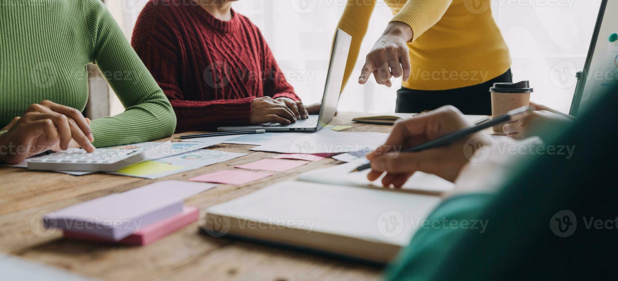 Brainstorming Collaboration and successful partnership analysis by Young business Asian people working in an office workspace photo
