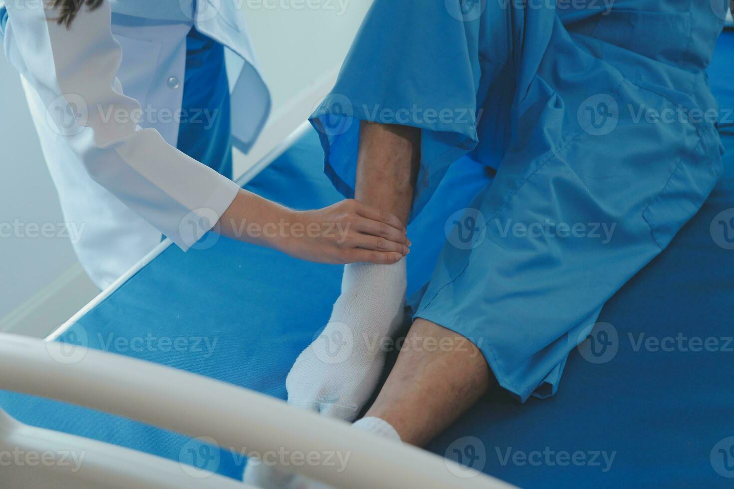 Patient doing some special exercises under supervision in a room photo