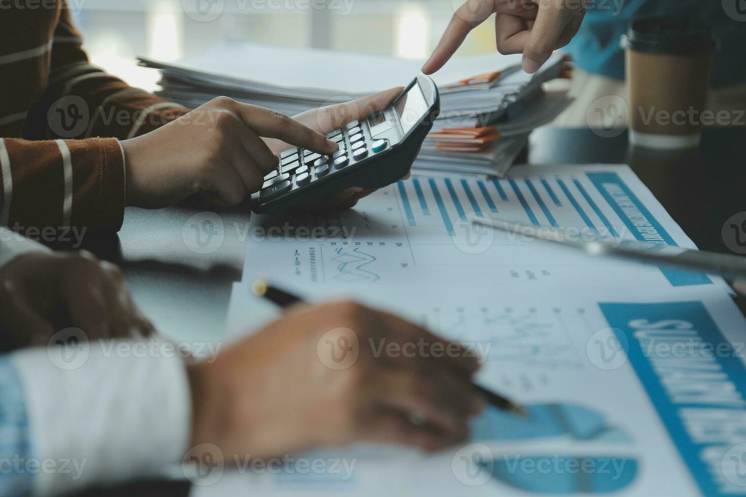 Brainstorming Collaboration and successful partnership analysis by Young business Asian people working in an office workspace photo