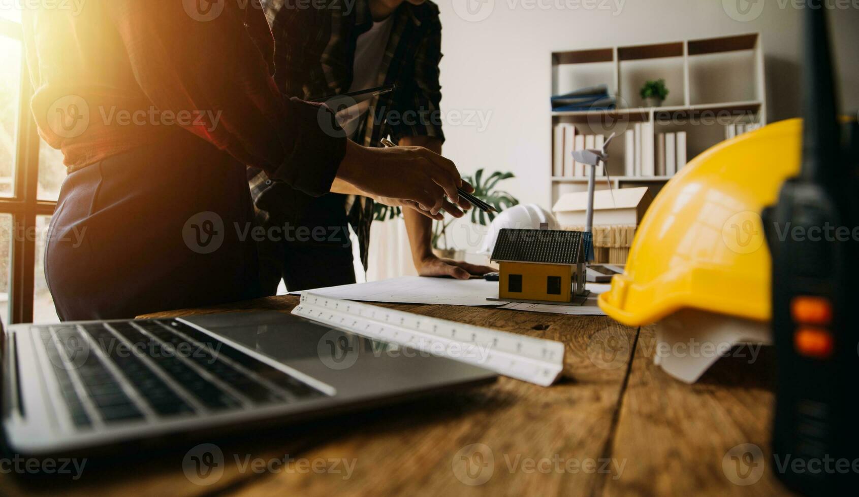 Professional Mechanical Engineer team Working on Personal Computer at Metal lathe industrial manufacturing factory. Engineer Operating lathe Machinery. Product quality Inspection photo
