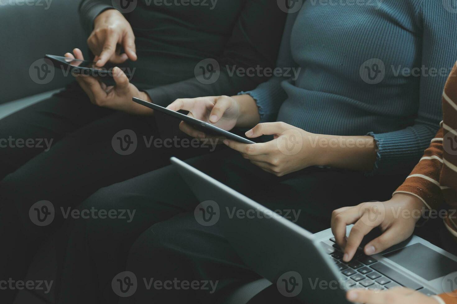 Asian Business woman using calculator and laptop for doing math finance on an office desk, tax, report, accounting, statistics, and analytical research concept photo