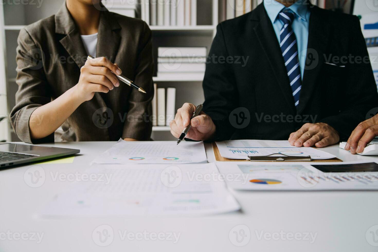 Businesswoman or accountant working Financial investment on calculator, calculate, analyze business and marketing growth on financial document data graph, Accounting, Economic, commercial concept. photo