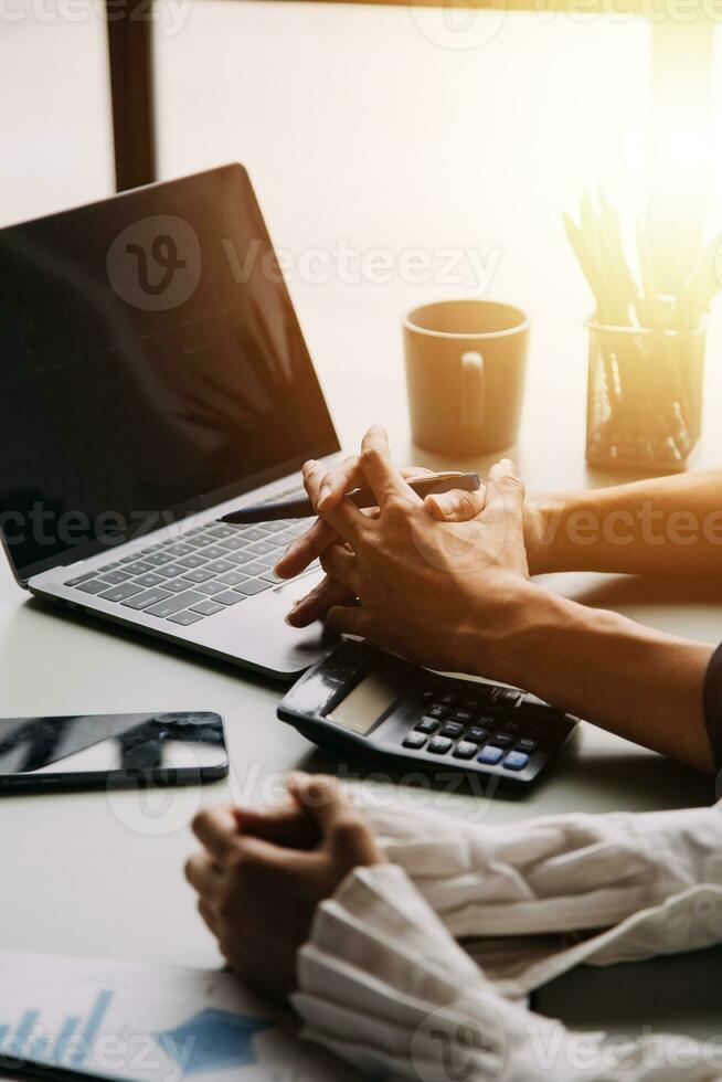 Financial Business team present. Business man hands hold documents with financial statistic stock photo, discussion, and analysis report data the charts and graphs. Finance Financial concept photo