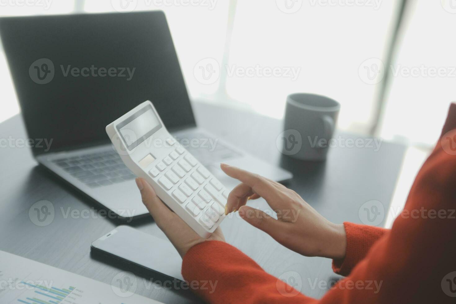Group of confident business people point to graphs and charts to analyze market data, balance sheet, account, net profit to plan new sales strategies to increase production capacity. photo