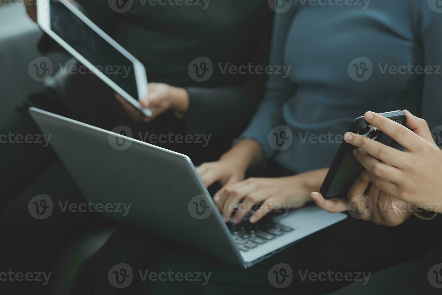 Asian Business woman using calculator and laptop for doing math finance on an office desk, tax, report, accounting, statistics, and analytical research concept photo