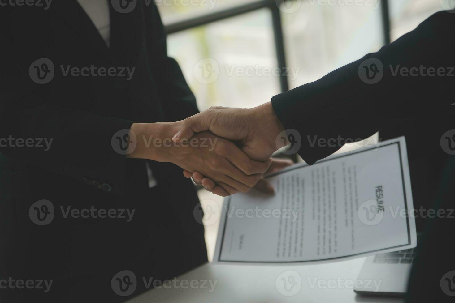 Close up view of job interview in office, focus on resume writing tips, employer reviewing good cv of prepared skilled applicant, recruiter considering application, hr manager making hiring decision photo