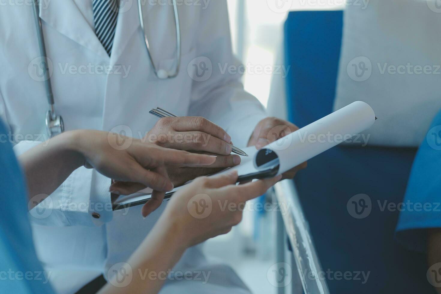 Injured patient showing doctor broken wrist and arm with bandage in hospital office or emergency room. Sprain, stress fracture or repetitive strain injury in hand. Nurse helping customer. First aid. photo