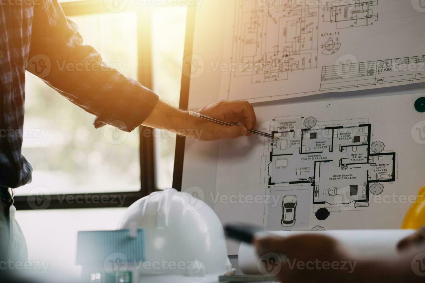 Professional Mechanical Engineer team Working on Personal Computer at Metal lathe industrial manufacturing factory. Engineer Operating lathe Machinery. Product quality Inspection photo