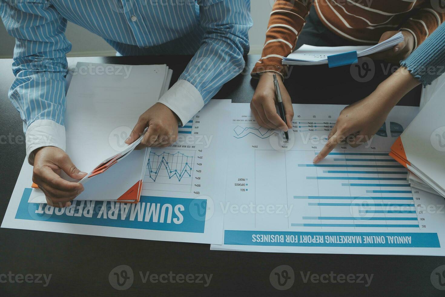 Brainstorming Collaboration and successful partnership analysis by Young business Asian people working in an office workspace photo