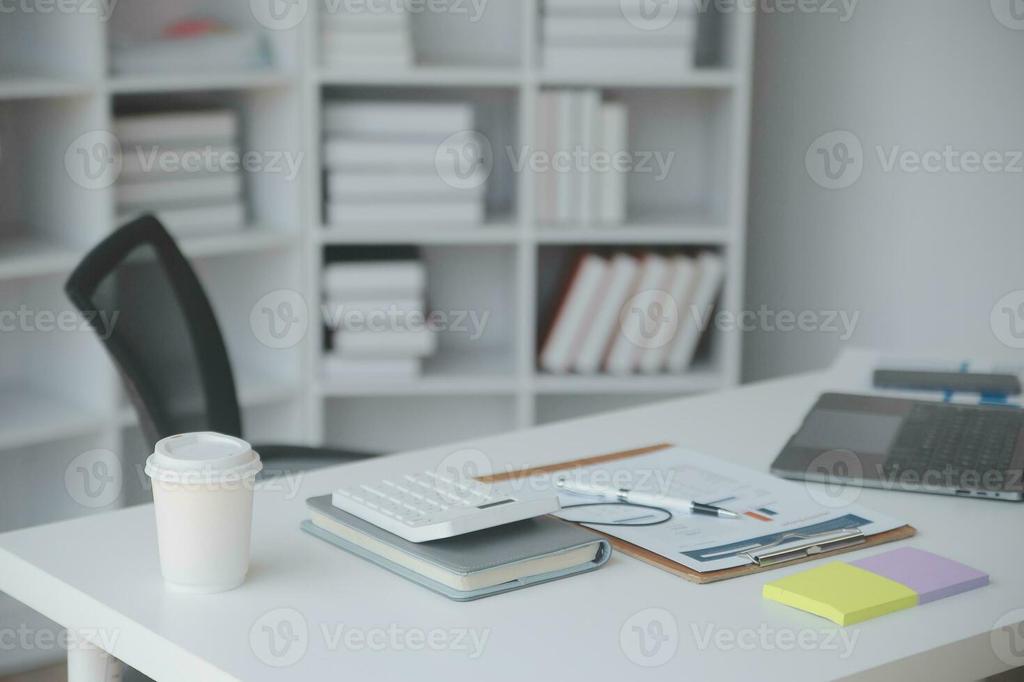 Financial analysts analyze business financial reports on a digital tablet planning investment project during a discussion at a meeting of corporate showing the results of their successful teamwork. photo