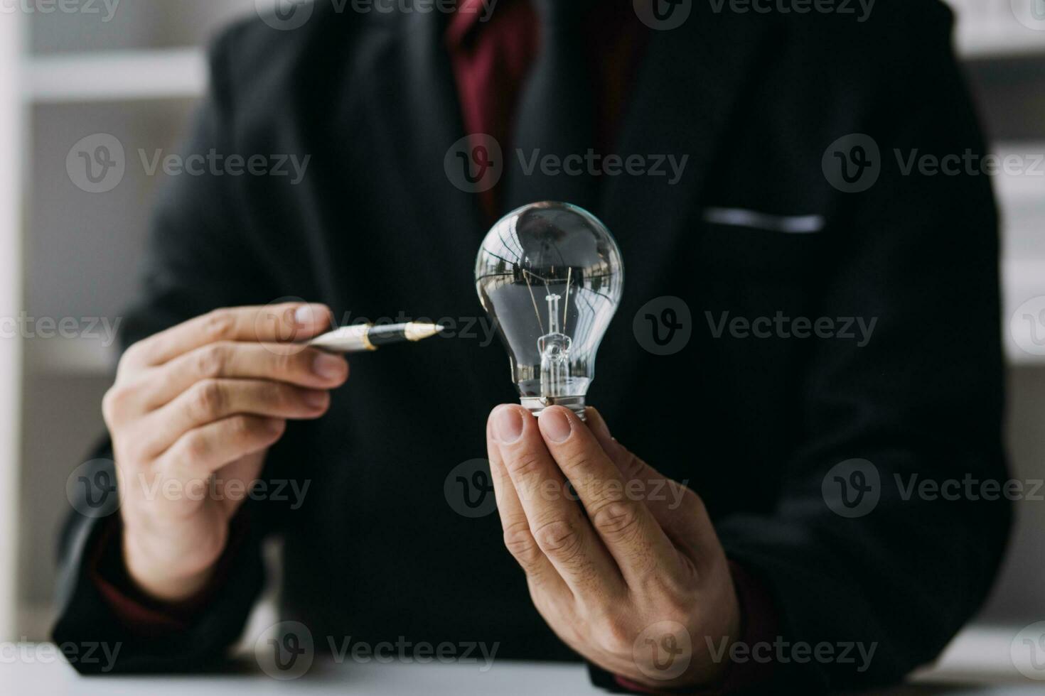 hand holding light bulb. idea concept with innovation and inspiration photo