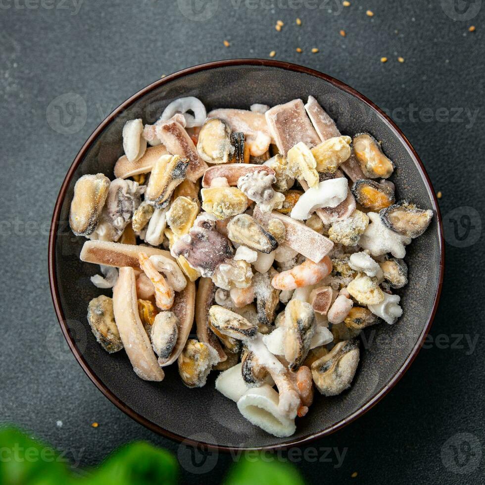 seafood salad frozen food mussels, rapan, octopus, scallop, squid healthy meal food snack on the table copy space food background rustic top view photo