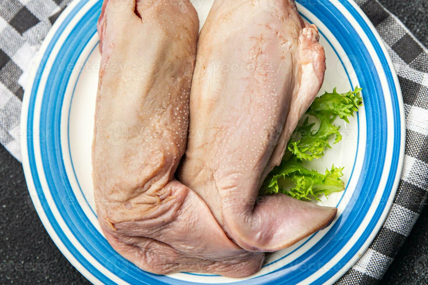raw tongue pork meat healthy meal food snack on the table copy space food background rustic top view keto or paleo diet photo