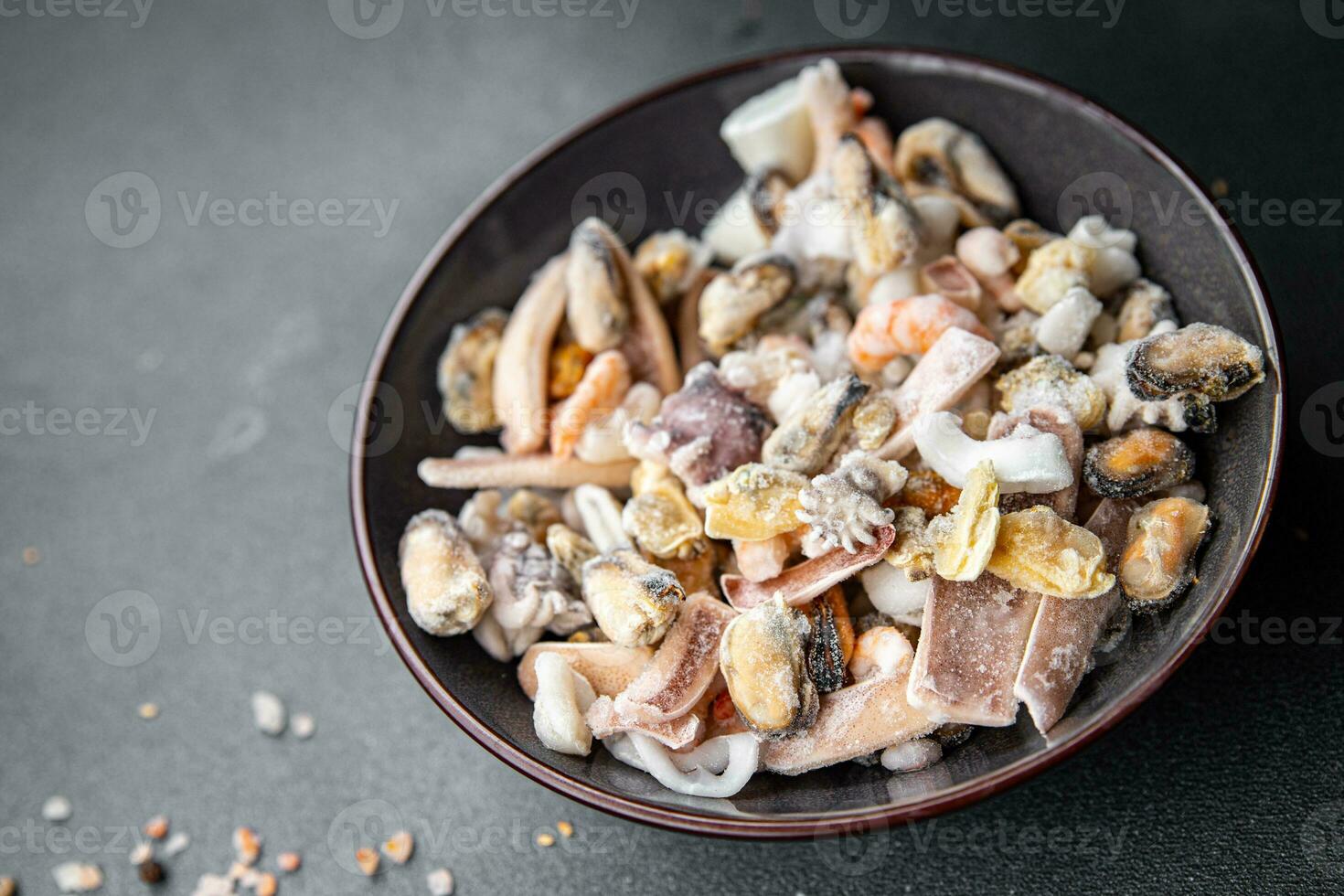 seafood salad frozen food mussels, rapan, octopus, scallop, squid healthy meal food snack on the table copy space food background rustic top view photo