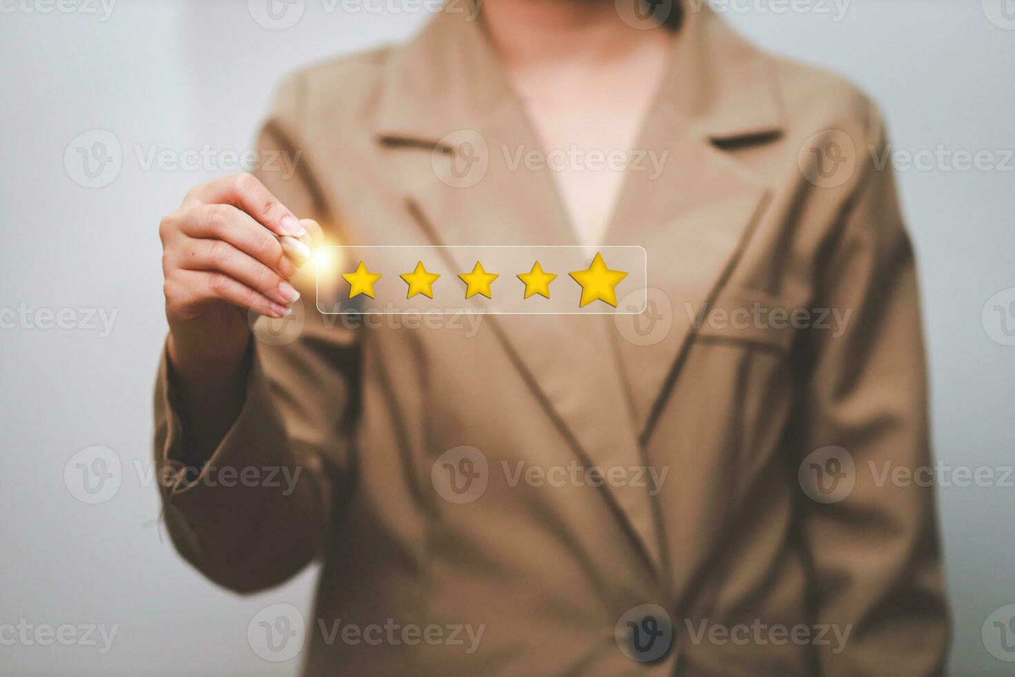 Customer pressing satisfaction with gold five star rating feedback icon and press level excellent rank for giving best score point to review the service , experience success business rate  concept. photo