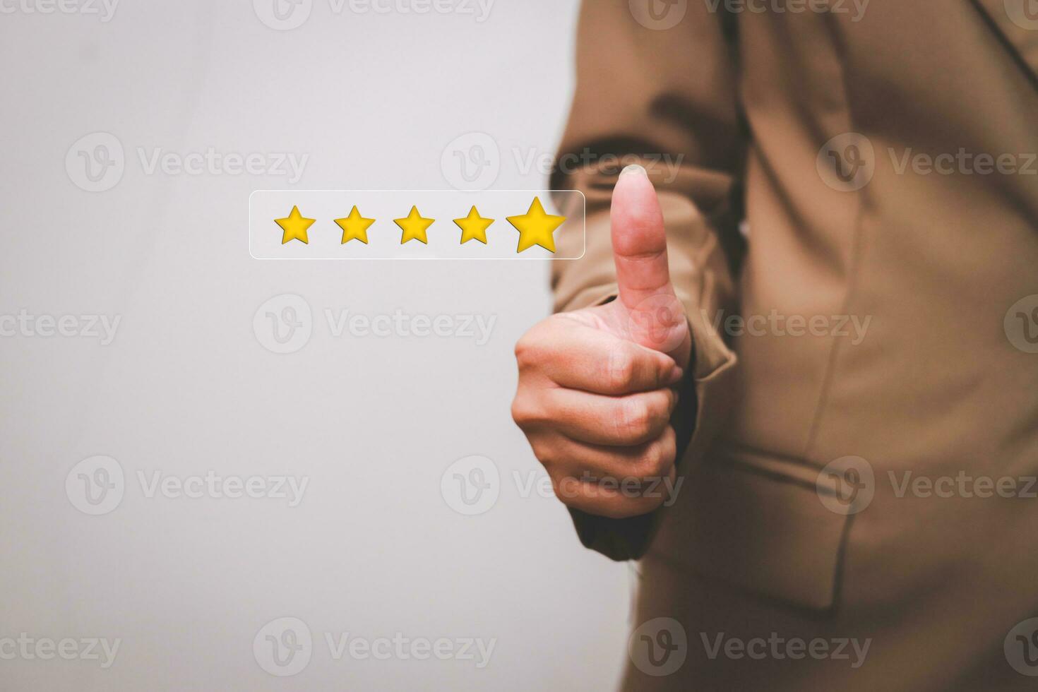 Customer pressing satisfaction with gold five star rating feedback icon and press level excellent rank for giving best score point to review the service , experience success business rate  concept. photo