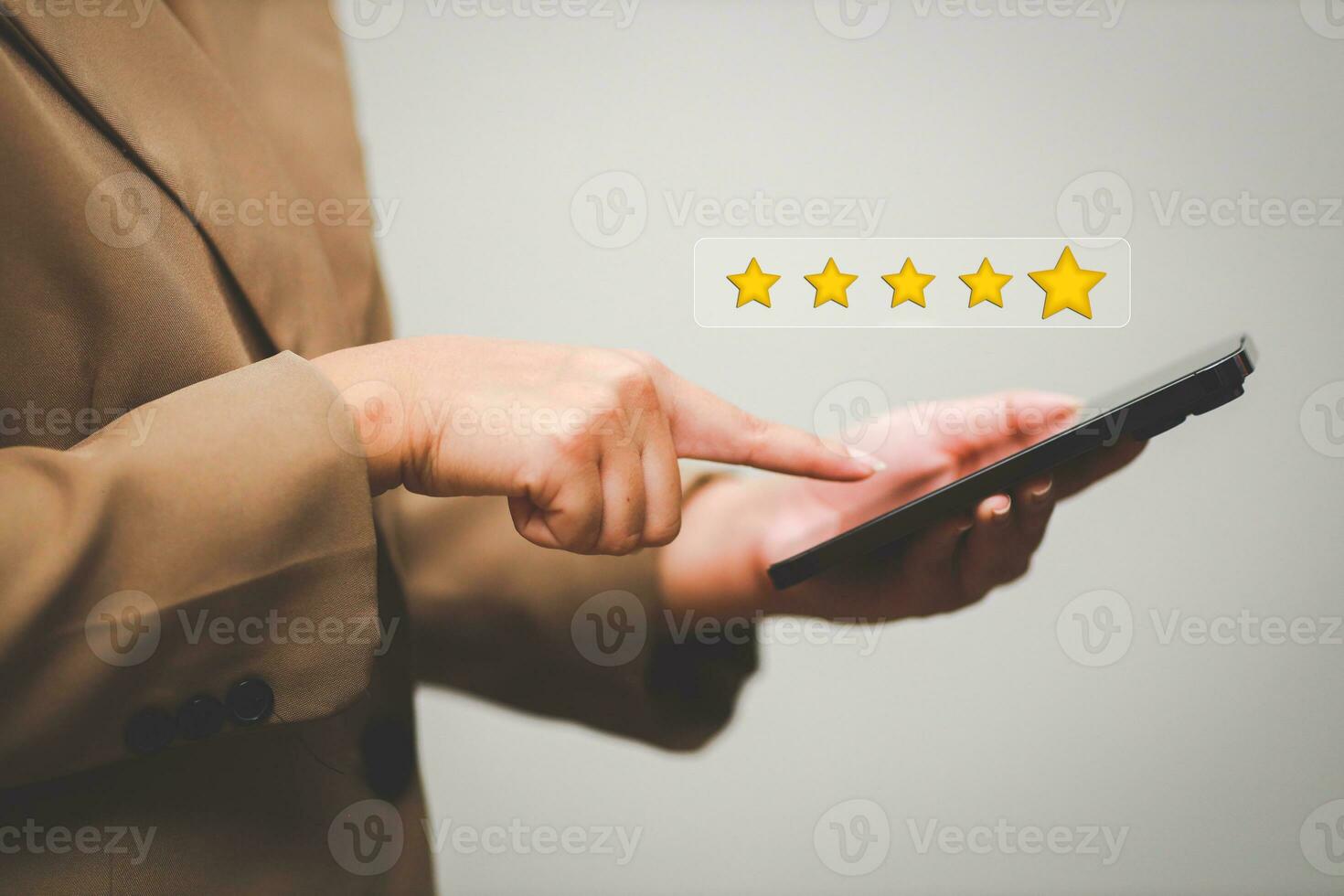 Customer pressing satisfaction with gold five star rating feedback icon and press level excellent rank for giving best score point to review the service , experience success business rate  concept. photo