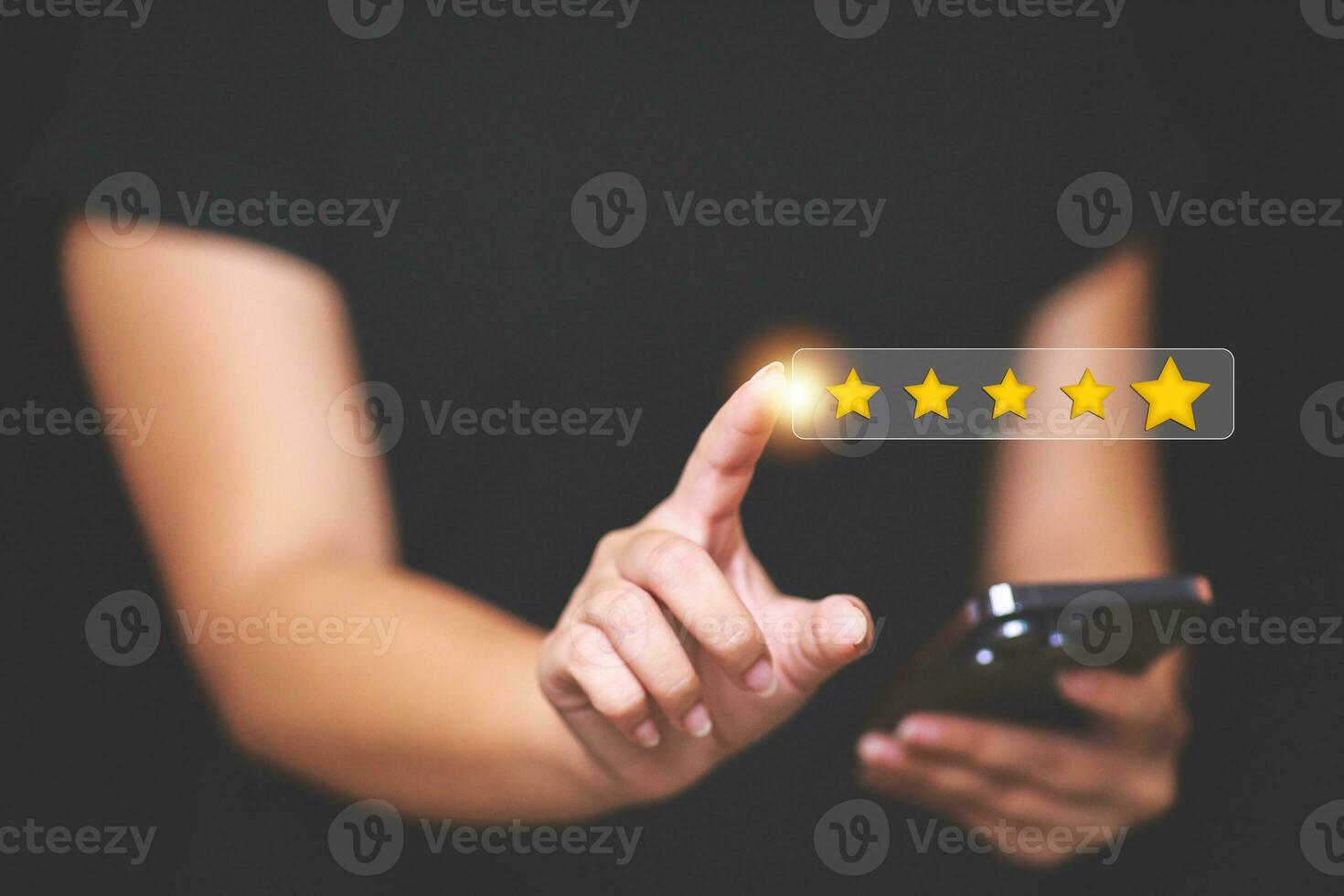 Customer pressing satisfaction with gold five star rating feedback icon and press level excellent rank for giving best score point to review the service , experience success business rate  concept. photo