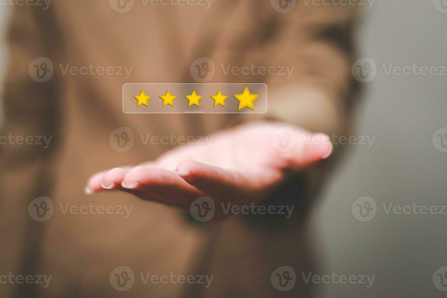 Customer pressing satisfaction with gold five star rating feedback icon and press level excellent rank for giving best score point to review the service , experience success business rate  concept. photo