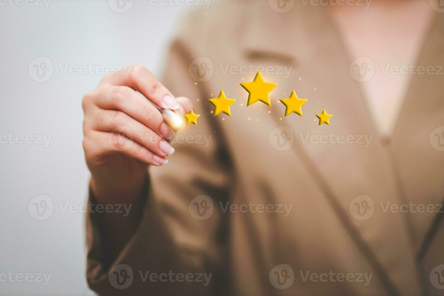 Customer pressing satisfaction with gold five star rating feedback icon and press level excellent rank for giving best score point to review the service , experience success business rate  concept. photo