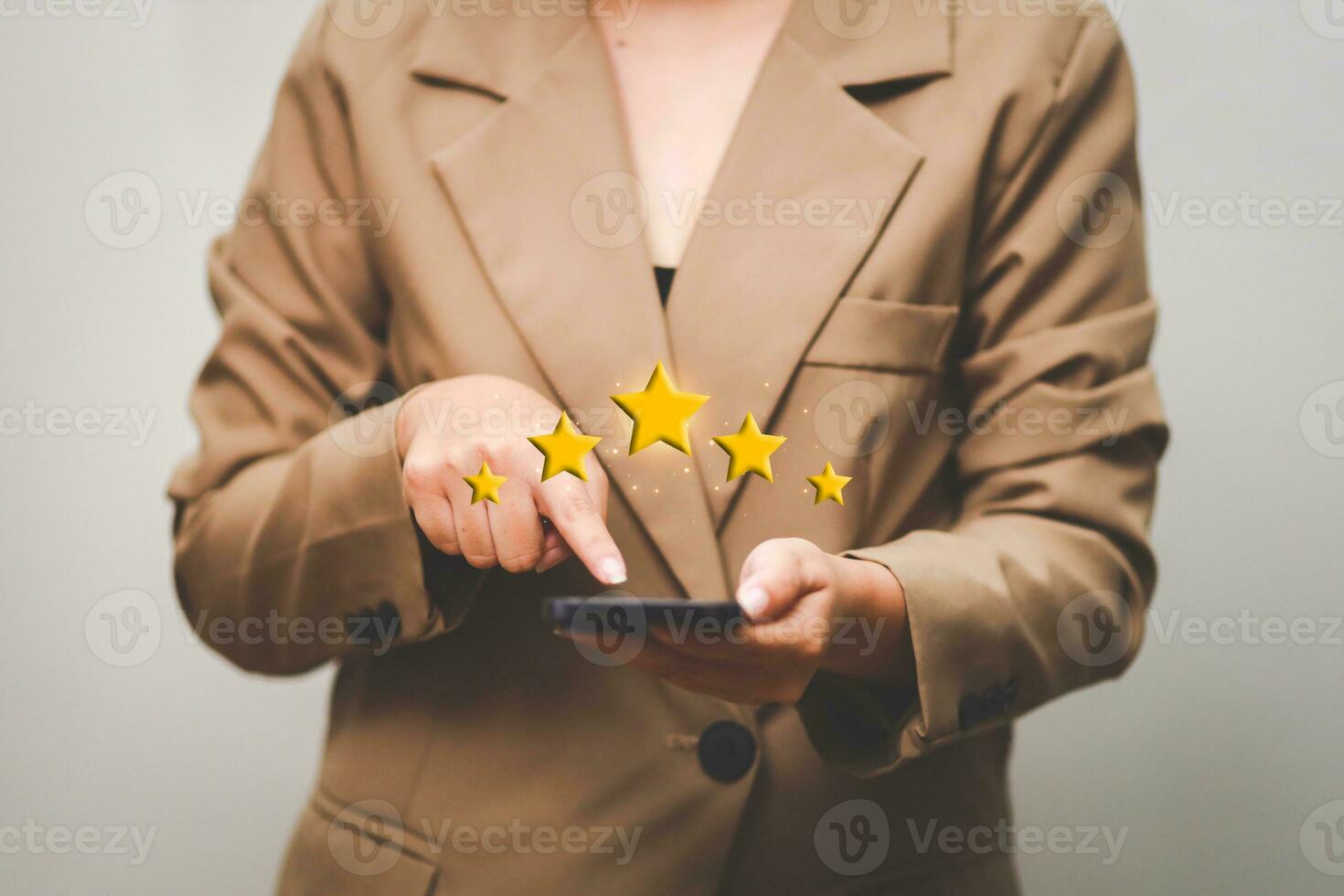 Customer pressing satisfaction with gold five star rating feedback icon and press level excellent rank for giving best score point to review the service , experience success business rate  concept. photo