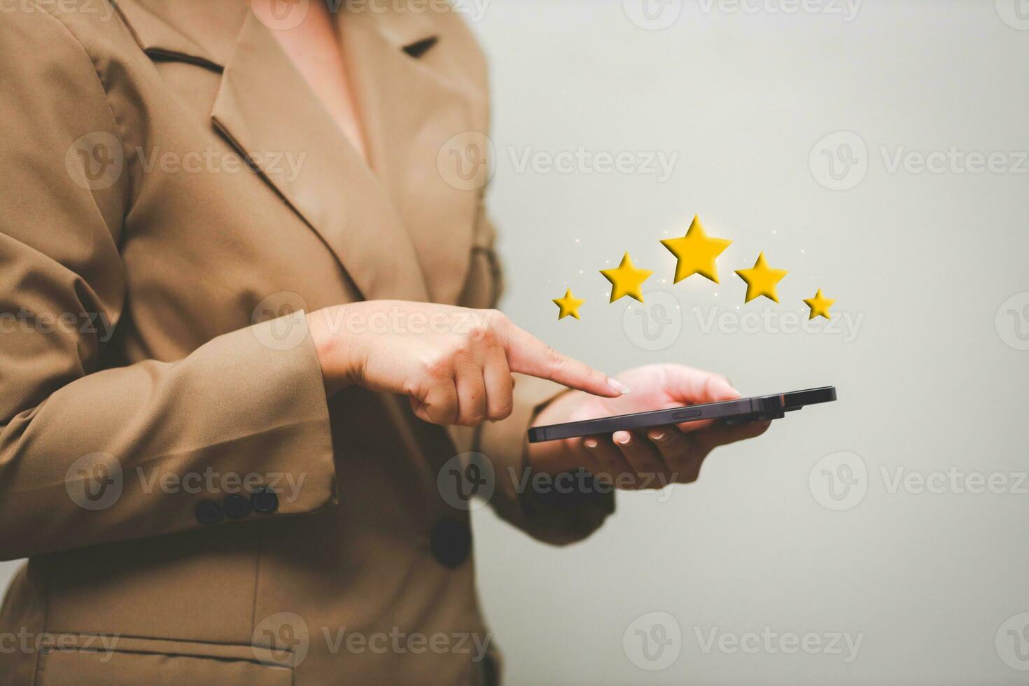 Customer pressing satisfaction with gold five star rating feedback icon and press level excellent rank for giving best score point to review the service , experience success business rate  concept. photo