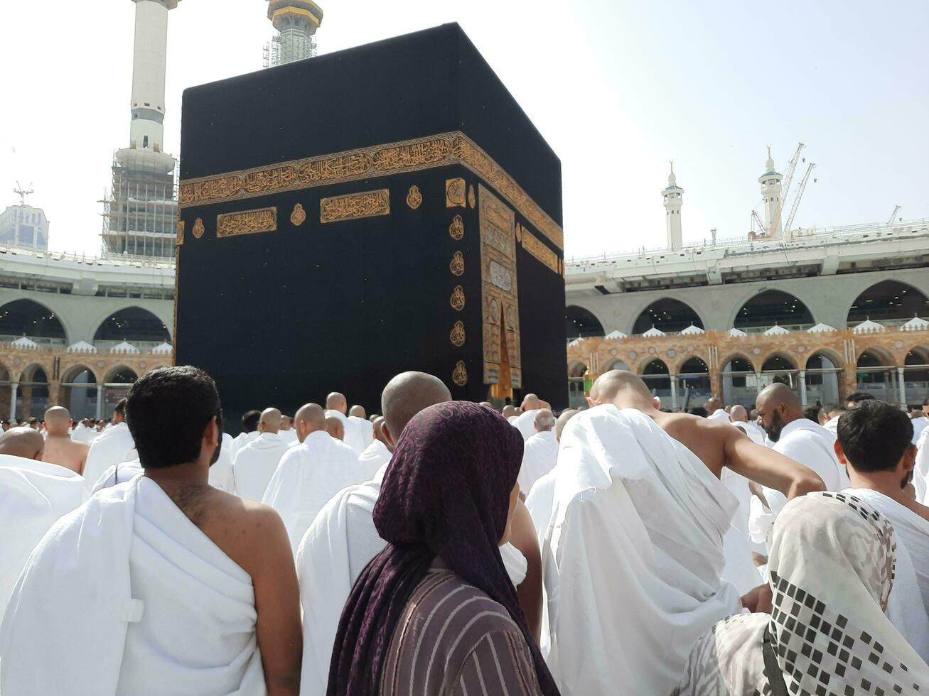 Mecca, Saudi Arabia, April 2023 - Pilgrims from all over the world are present in the courtyard of Masjid al-Haram for Tawaf. photo