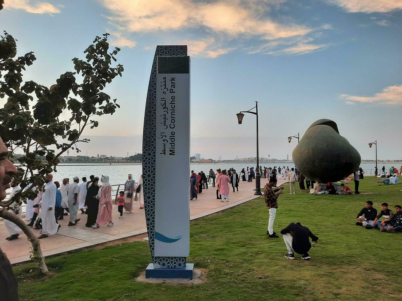 Jeddah, Saudi Arabia, April 2023 - Beautiful evening view of Jeddah Corniche. A large number of people are seen in the park of Jeddah Corniche. photo