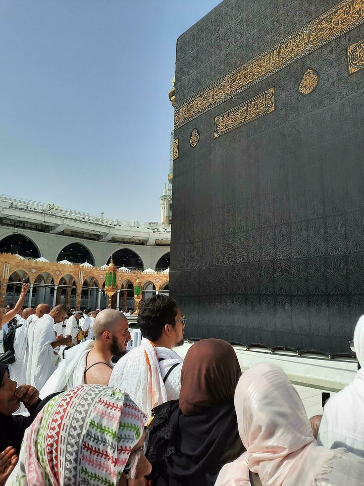 Mecca, Saudi Arabia, April 2023 - Pilgrims from all over the world are present in the courtyard of Masjid al-Haram for Tawaf. photo