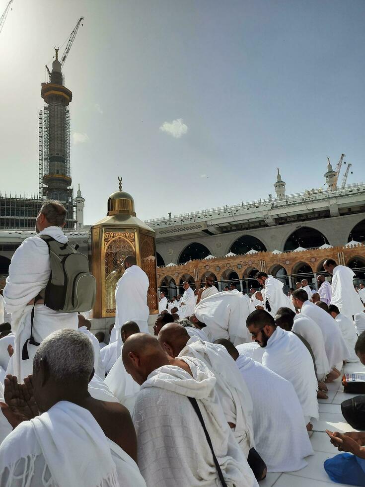 Mecca, Saudi Arabia, April 2023 - Pilgrims from all over the world are present in the courtyard of Masjid al-Haram for Tawaf. photo