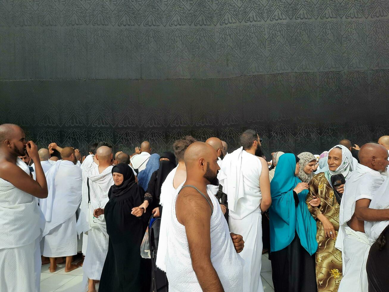 Mecca, Saudi Arabia, April 2023 - Pilgrims from all over the world are present in the courtyard of Masjid al-Haram for Tawaf. photo