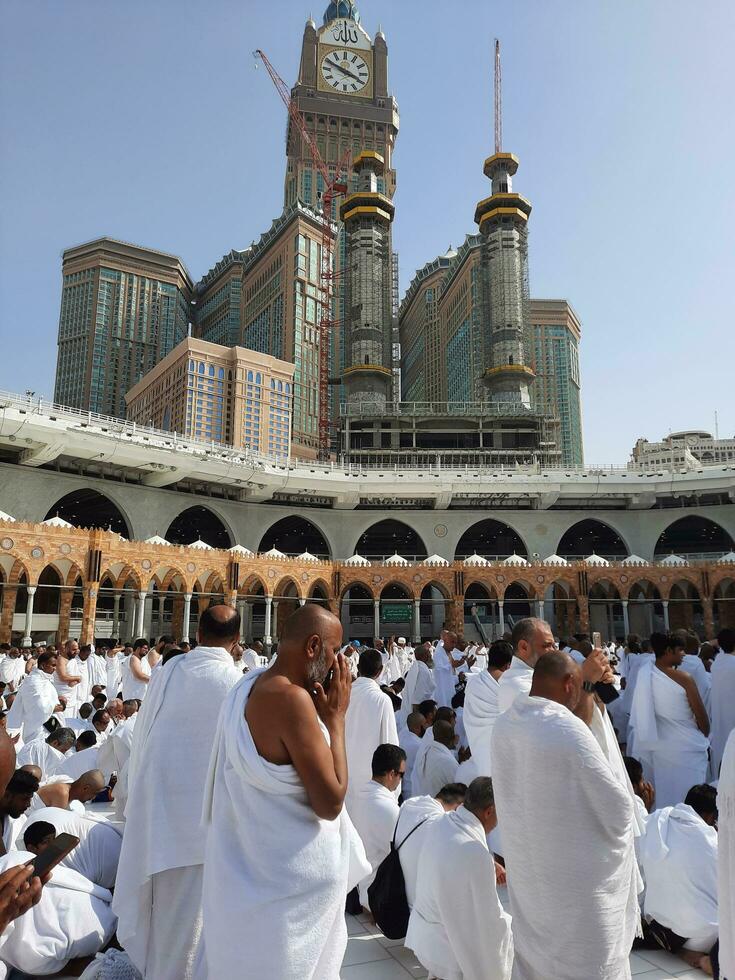 Mecca, Saudi Arabia, April 2023 - Pilgrims from all over the world are present in the courtyard of Masjid al-Haram for Tawaf. photo