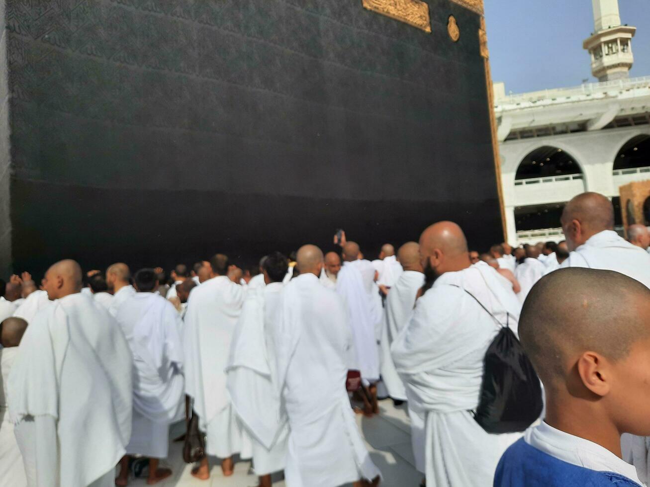 Mecca, Saudi Arabia, April 2023 - Pilgrims from all over the world are present in the courtyard of Masjid al-Haram for Tawaf. photo