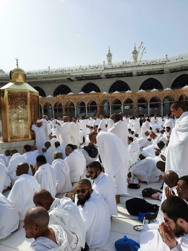 Mecca, Saudi Arabia, April 2023 - Pilgrims from all over the world are present in the courtyard of Masjid al-Haram for Tawaf. photo