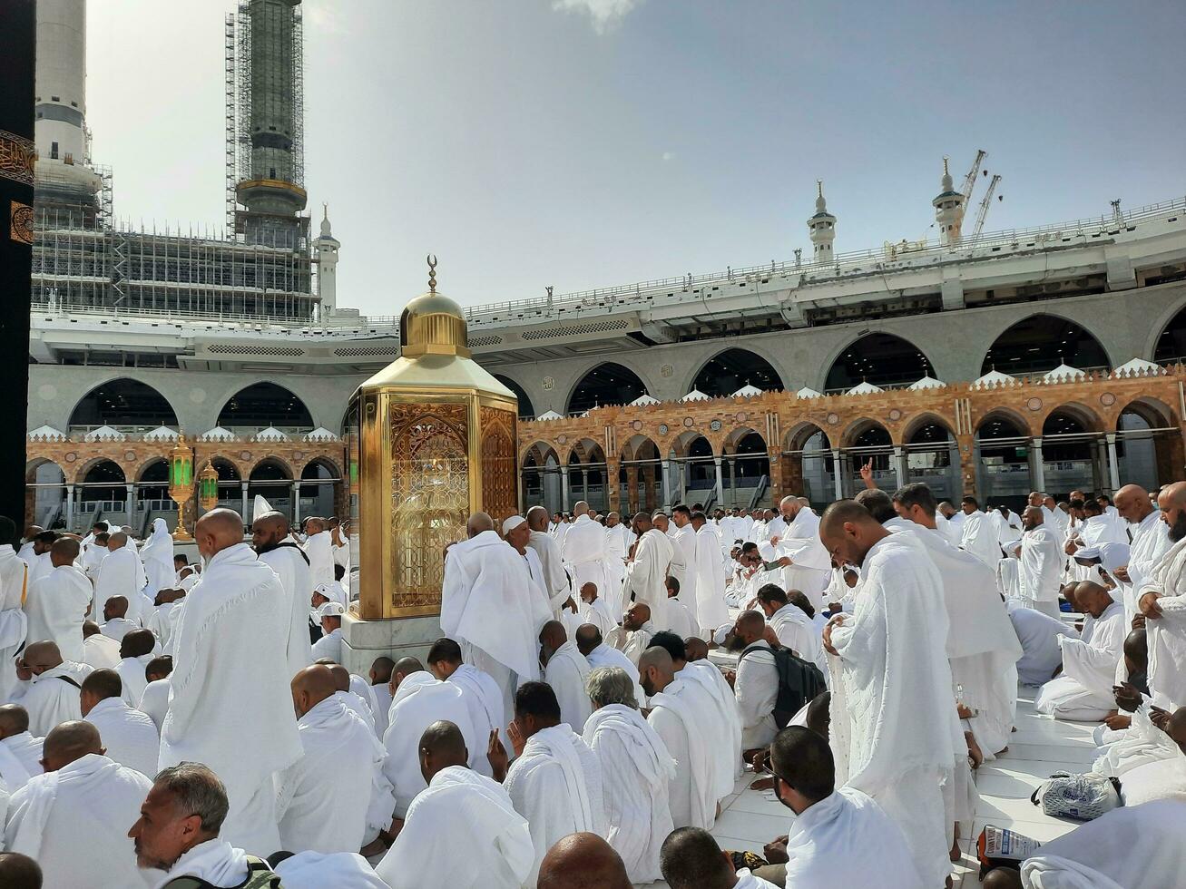 Mecca, Saudi Arabia, April 2023 - Pilgrims from all over the world are present in the courtyard of Masjid al-Haram for Tawaf. photo