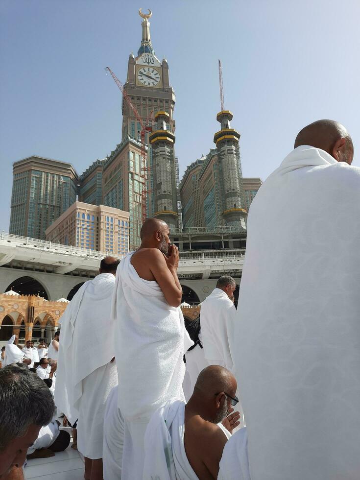 Mecca, Saudi Arabia, April 2023 - Pilgrims from all over the world are present in the courtyard of Masjid al-Haram for Tawaf. photo