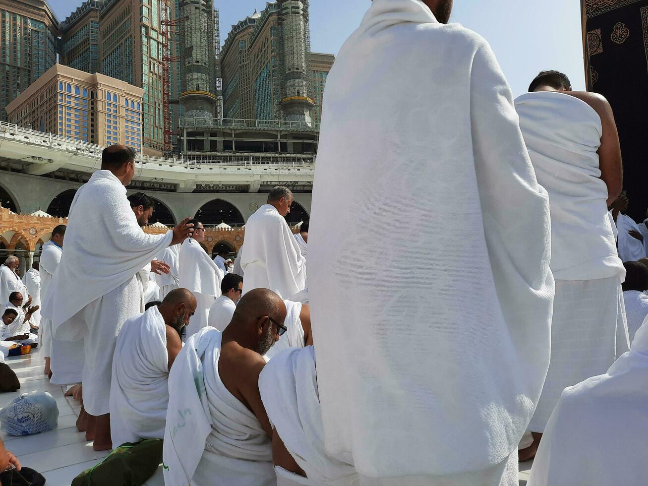 Mecca, Saudi Arabia, April 2023 - Pilgrims from all over the world are present in the courtyard of Masjid al-Haram for Tawaf. photo