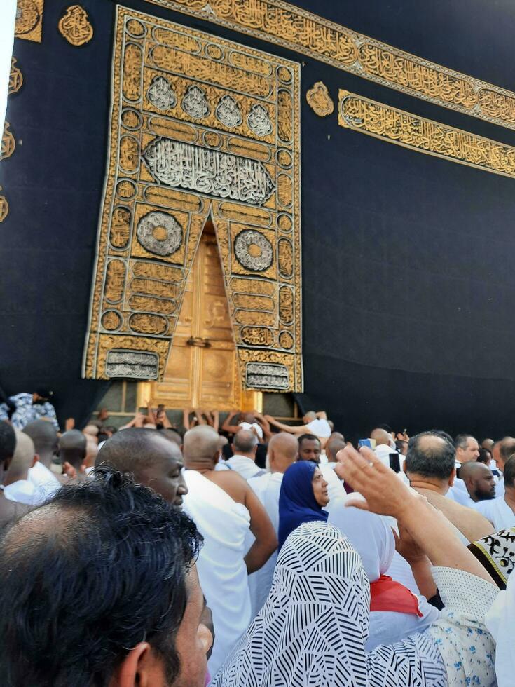 Mecca, Saudi Arabia, April 2023 - Pilgrims from all over the world are present in the courtyard of Masjid al-Haram for Tawaf. photo