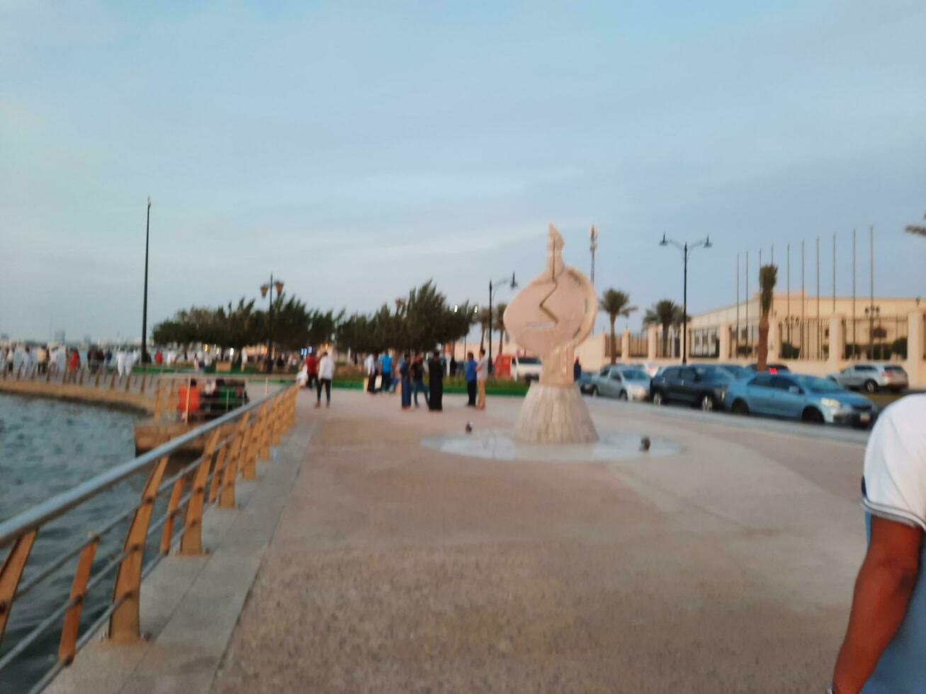 Jeddah, Saudi Arabia, April 2023 - Beautiful evening view of Jeddah Corniche. A large number of people are seen in the park of Jeddah Corniche. photo